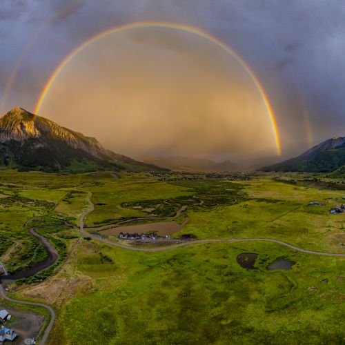 A rainbow arcs over Crested Butte.