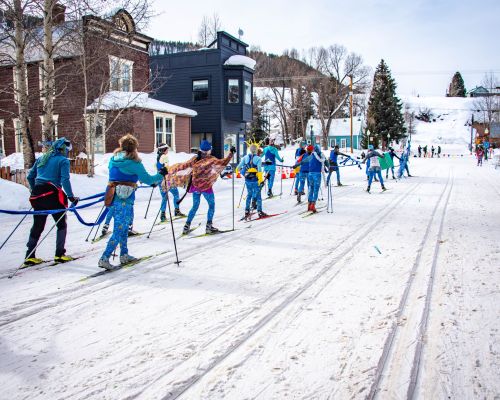 Participants in the alley loop crested butte. This nordic ski race encourages costumes and fun.