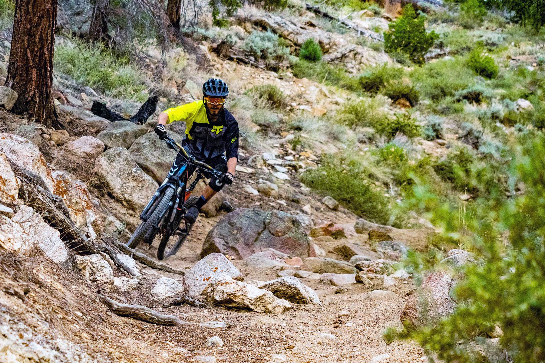 A mountain biker rides a rocky section of Doctor Park trail