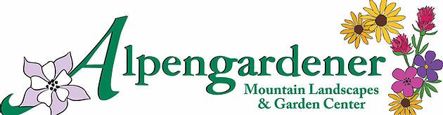 Alpengardener in Crested Butte, an outdoor garden center with rows of flowers and plants. A building with large windows sits behind the garden.