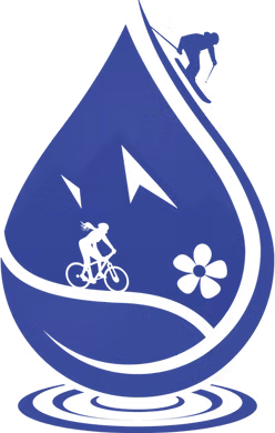 A woman relaxing in a plush chair by a window with a mountain view getting a treatment from Revive IV Spa in Crested Butte.