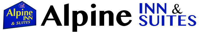 Alpine Inn in Gunnison. The hotel is two stories. There is an overhang roof area above the pull through to unload baggage and check-in. The overhang has a silhouette of a cowboy and a cowgirl, one on each column. A statue of a bighorn sheep stands in a garden in front of the hotel.