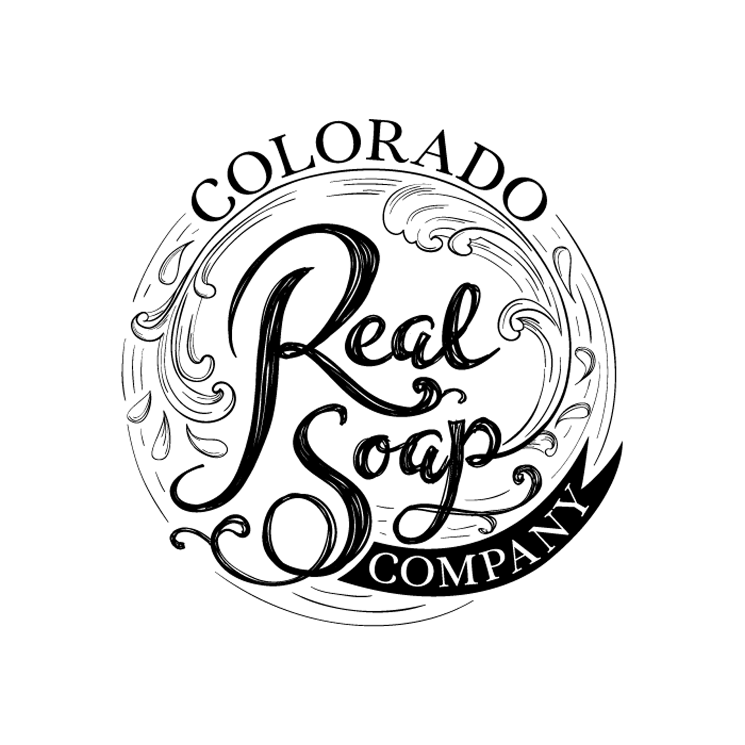 A bar of soap in a soap dish next to a flower. The label says "Welcome to my world of wildcrafted & infused......Soaps, Lotions, Potions. And I want to share it with you." A circular logo that says "Colorado Real Soap Company" also rests on the logo.