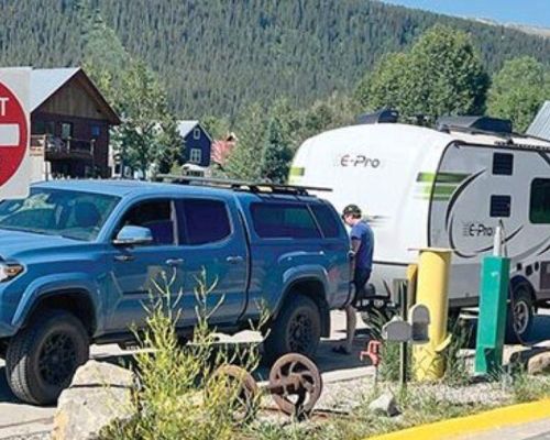 A truck pulling a trailer at the Crested Butte RV dump station.