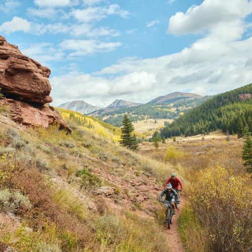 Two mountain bikers on Upper Cement Creek, a trail that winds through a rocky little canyon