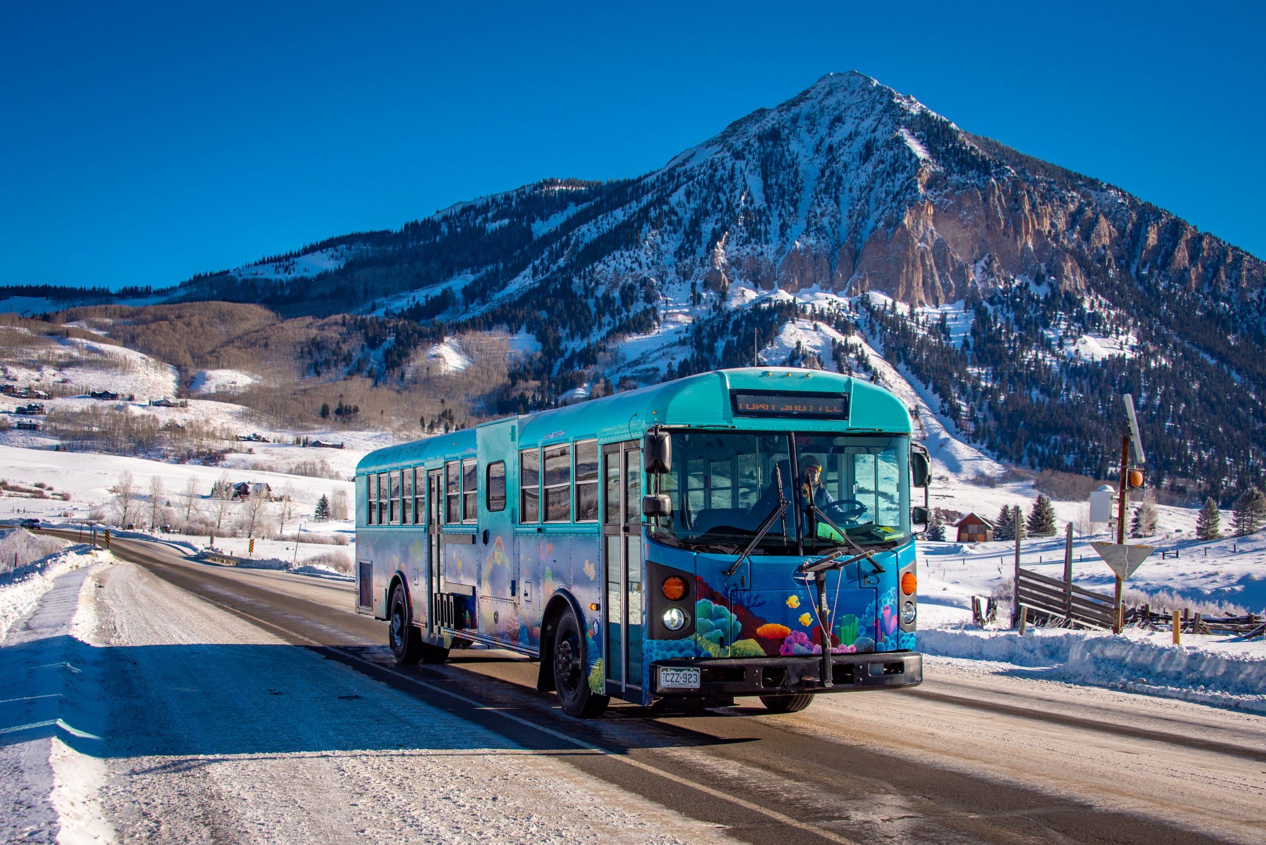 A bus drives in Crested Butte, Colorado
