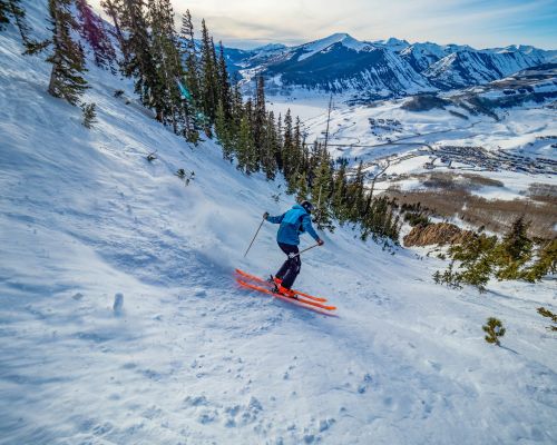 A skier on a steep slope