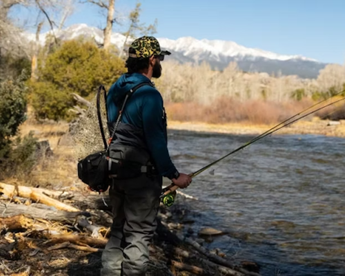 a person fly fishing on a property connected with rare waters