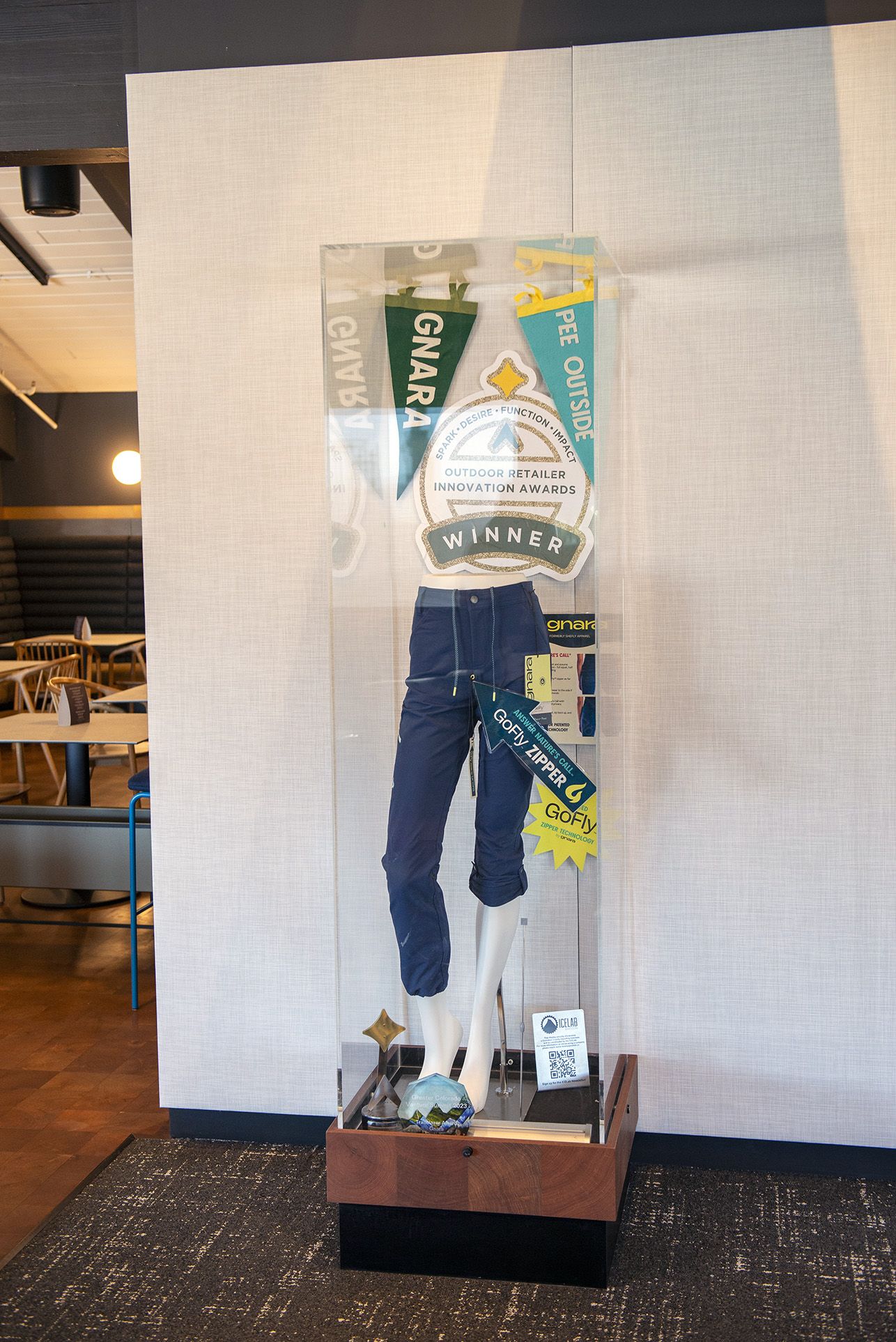 A Gunnison Crested-Butte Airport advertising display case with Gnara products