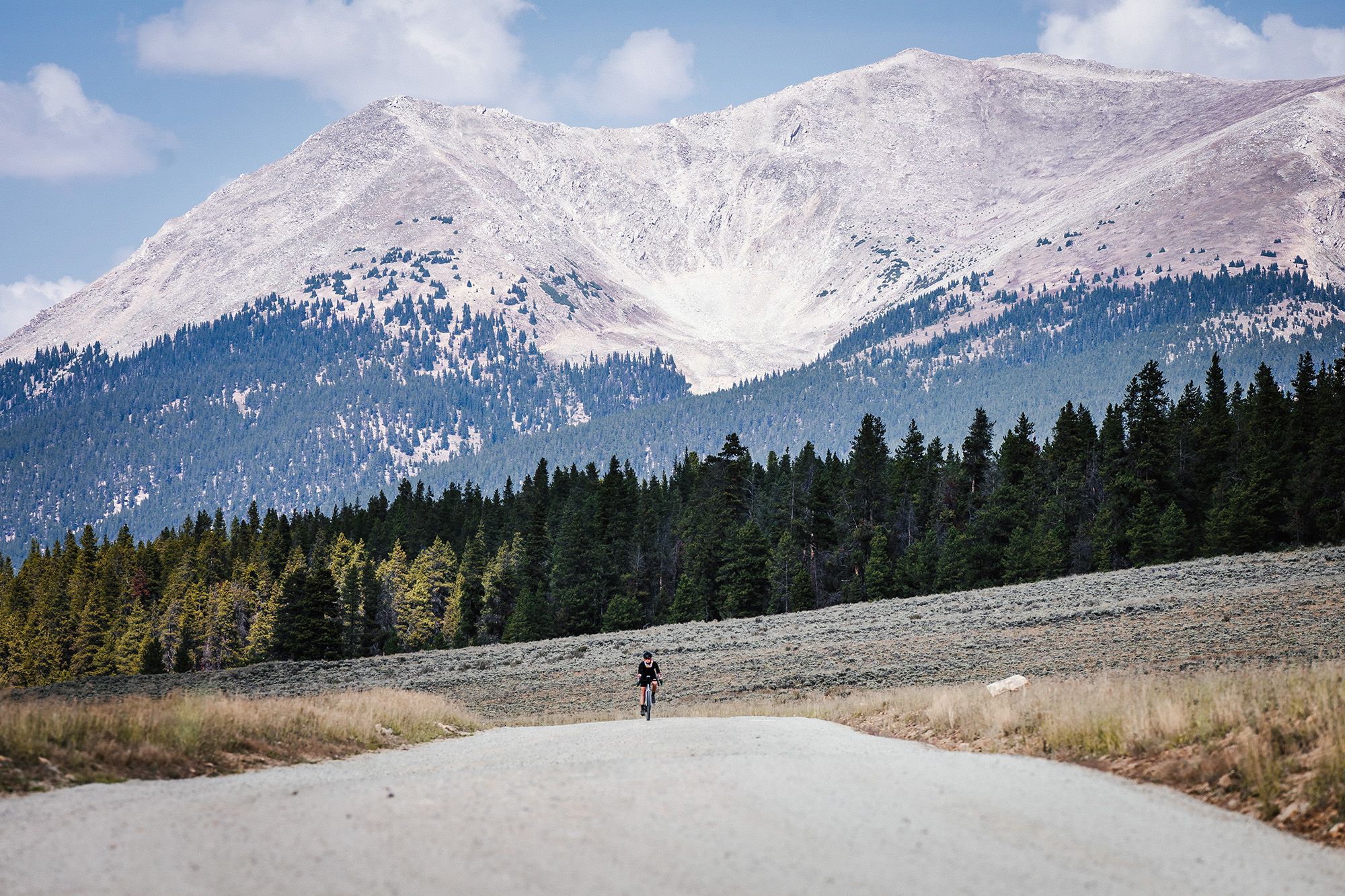 Gravel biking in Colorado with a massive mountain in the background