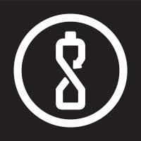 a water bottle with little pieces of plastic coming off it designed to show the process stoked plastics uses to recycle plastic