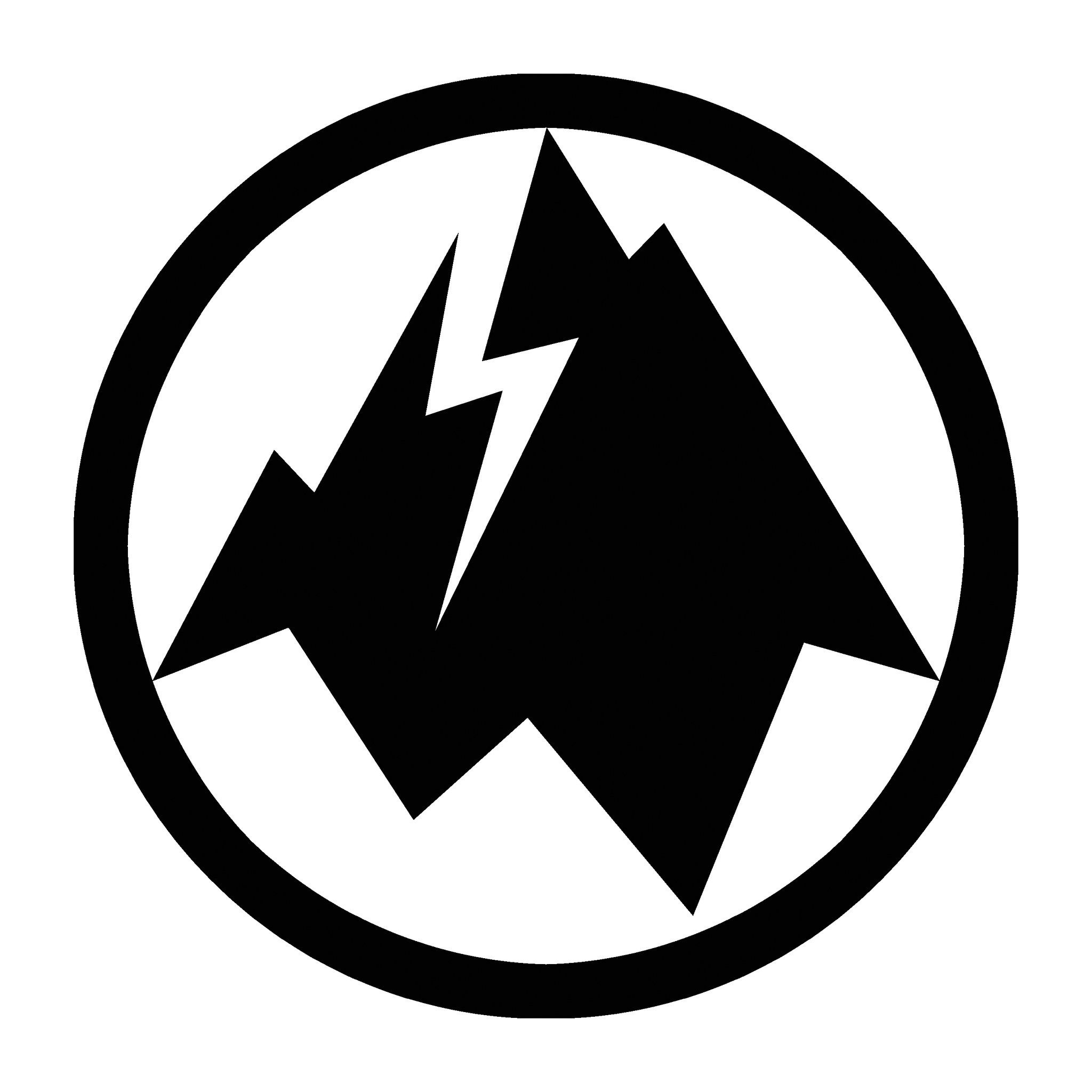 The interior of terrible mountain gallery in pitkin. the gallery is warm wood with a leather couch, colorful rug and plants. Paintings of nature and landscapes line the walls.