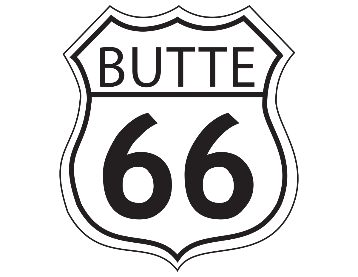 butte 66 crested butte mountain resort. a restaurant with a large deck and tables with umbrellas overlooks a concrete patio and the base of a ski area.