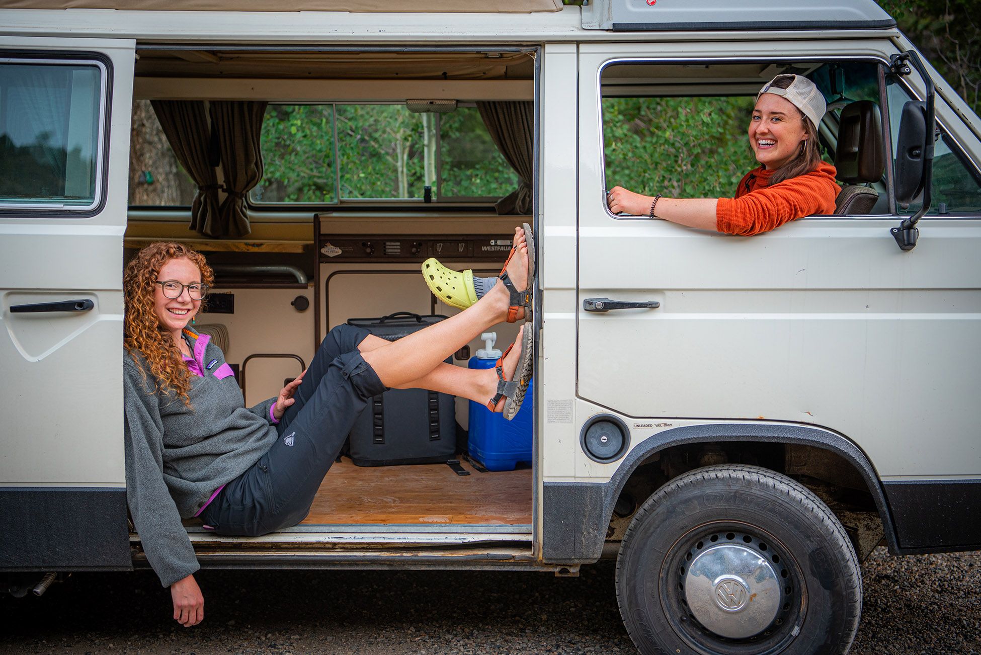 The founders of Shefly Apparel hang out in a van in Gunnison.
