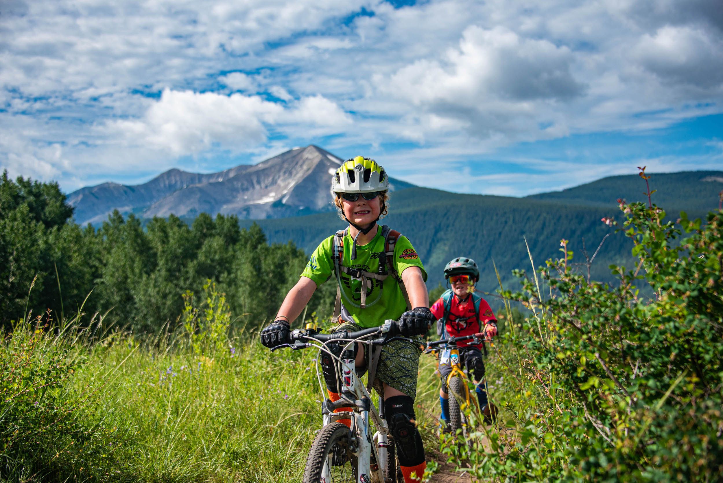 two kids mountain biking with the cb devo team