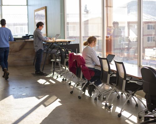 three people using office space at the ICELab@Western