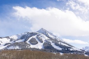 A snow-covered mountain with a pointed peak