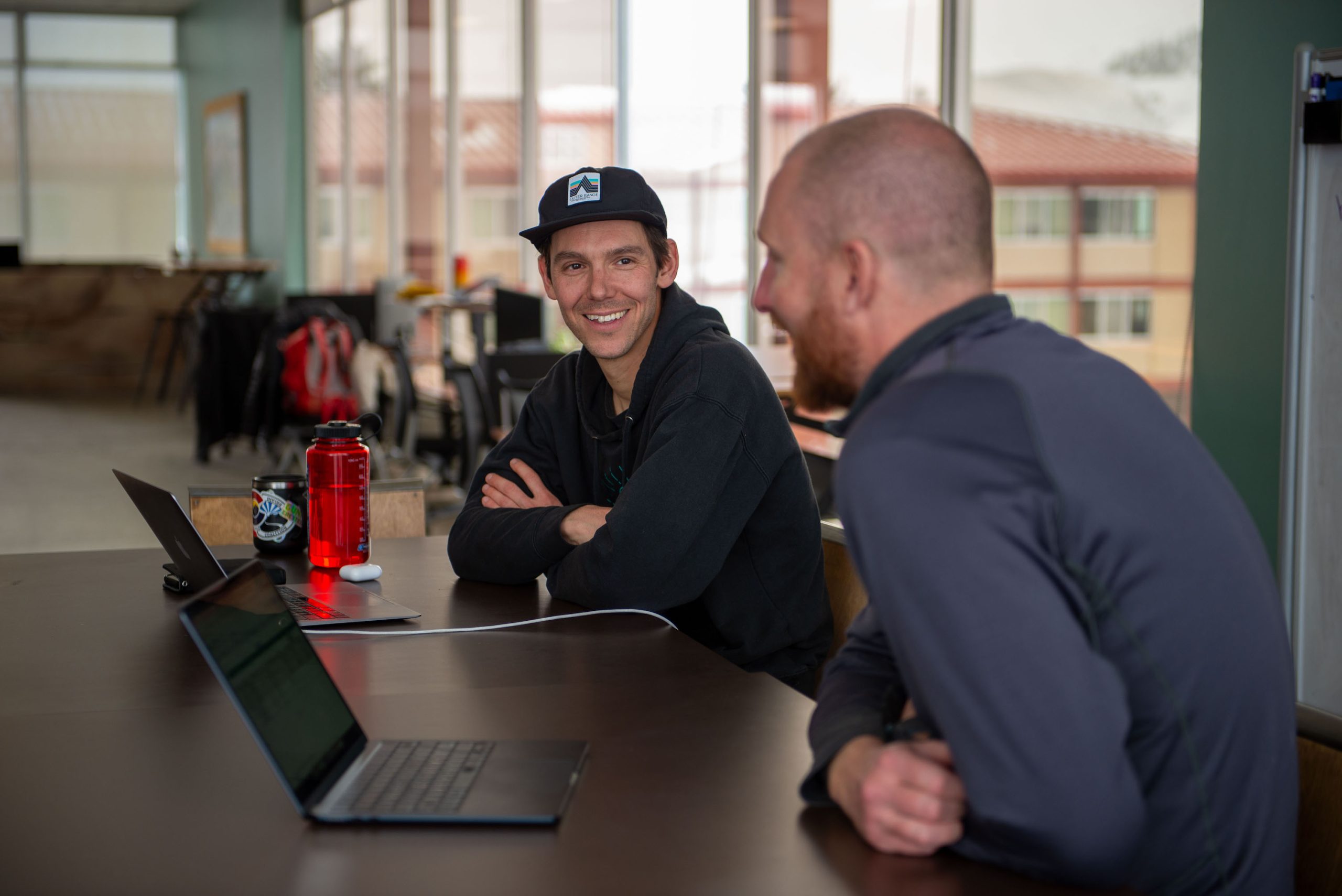 Two men talking at the ICELab, a coworking space in Gunnison, CO