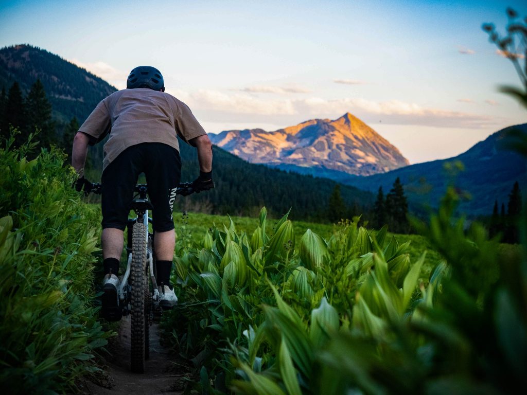 A mountain biker in Crested Butte, CO at sunset