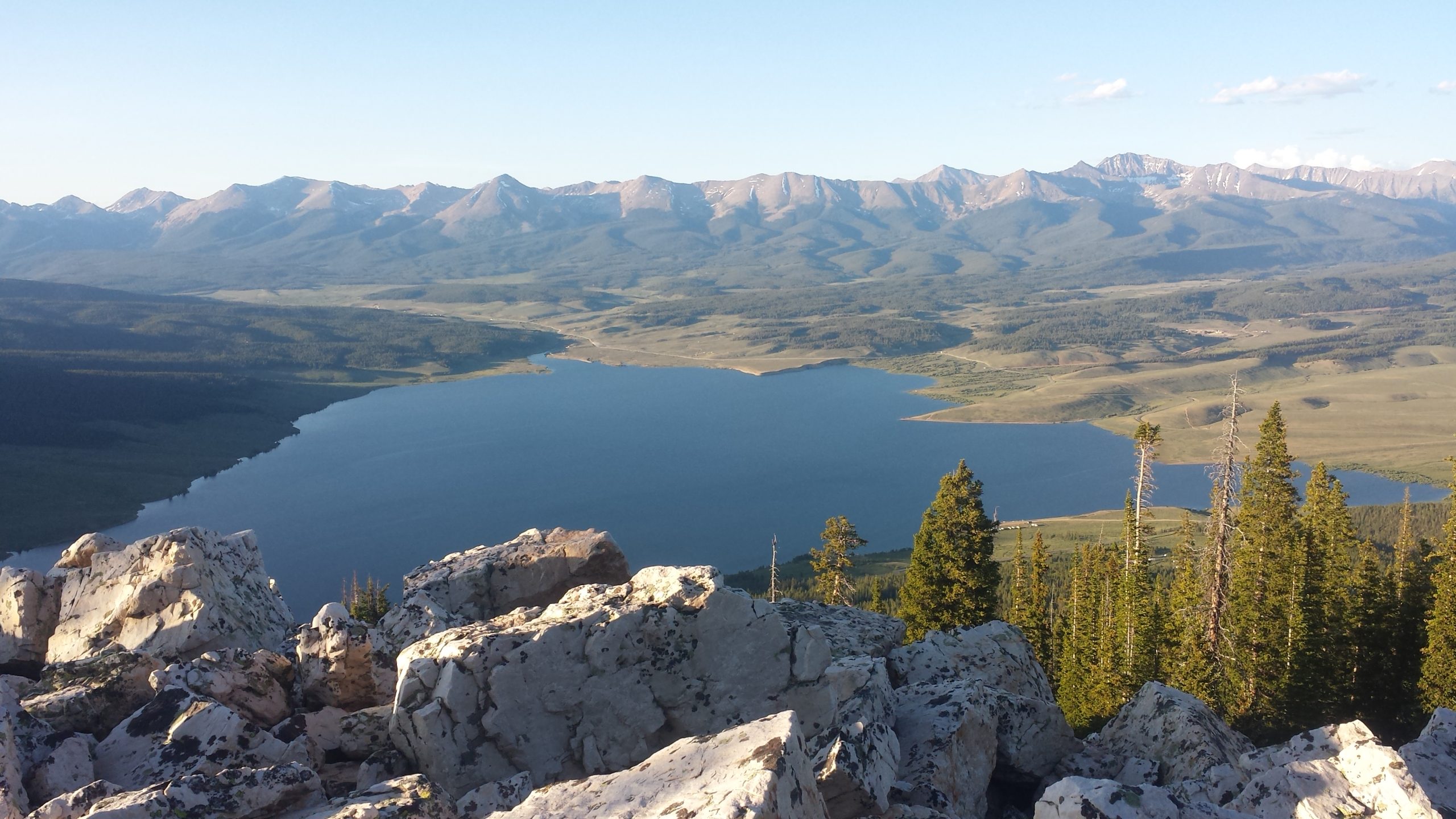 A view of a large reservoir surrounded by trees