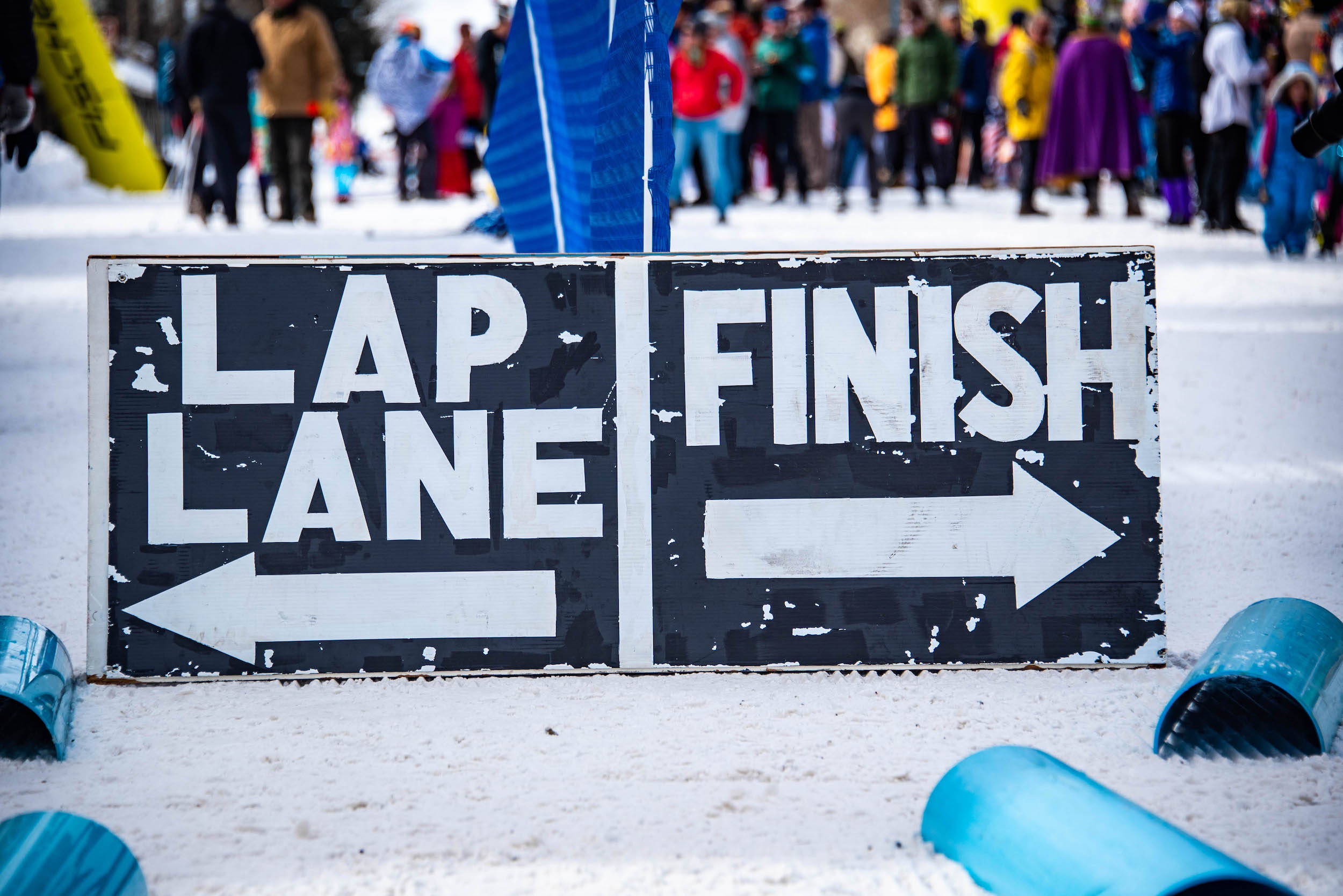 Signs that say "Lap lane" and "finish" with arrows for the alley loop crested butte