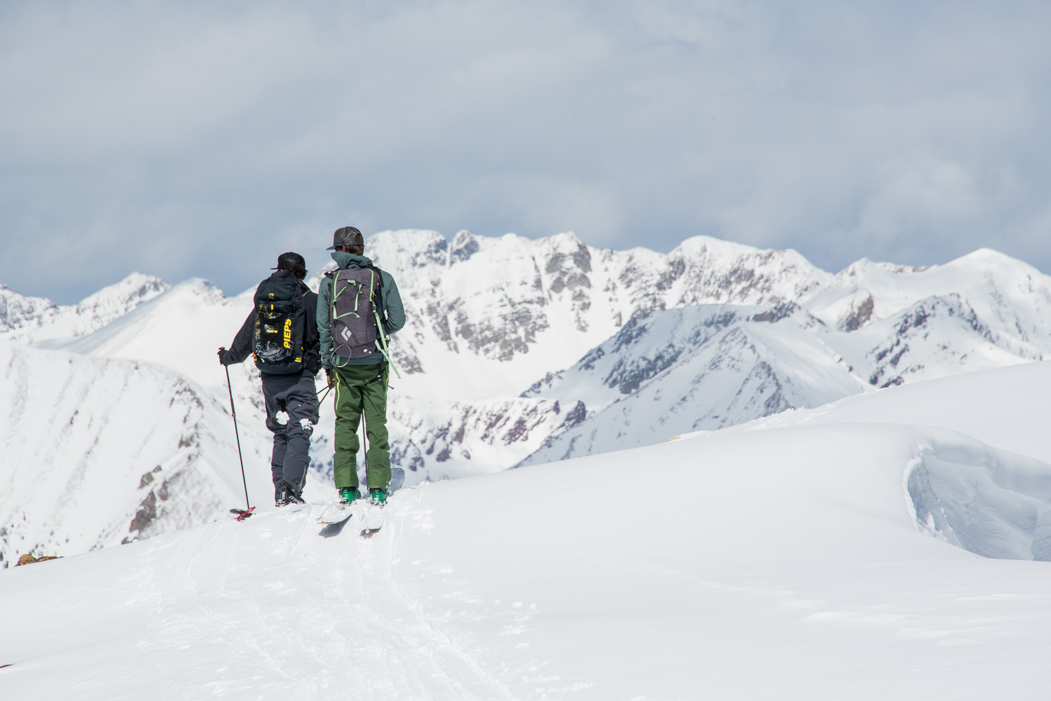 Two people backcountry skiing in Crested Butte