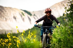 MTB through yellow wildflowers in Crested Butte.