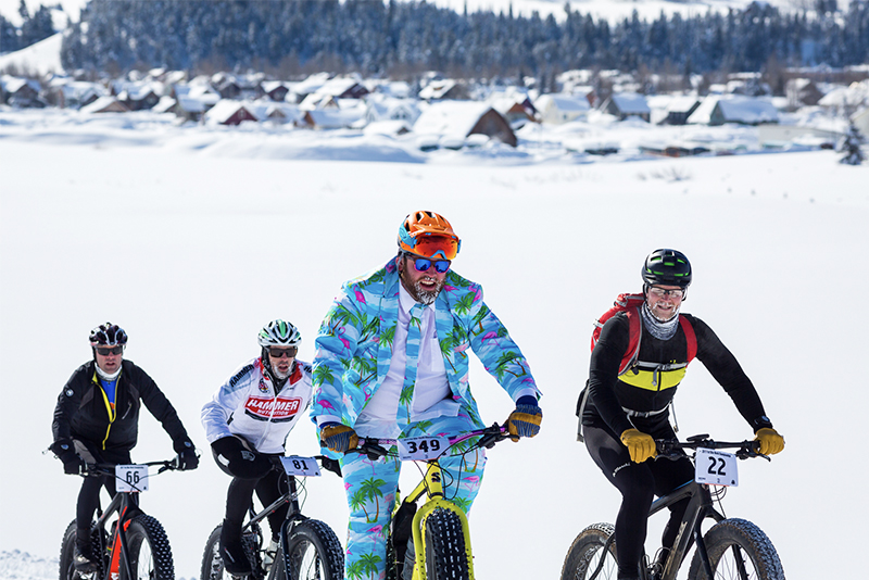 Fat tire bikers riding through snow in Crested Butte Colorado