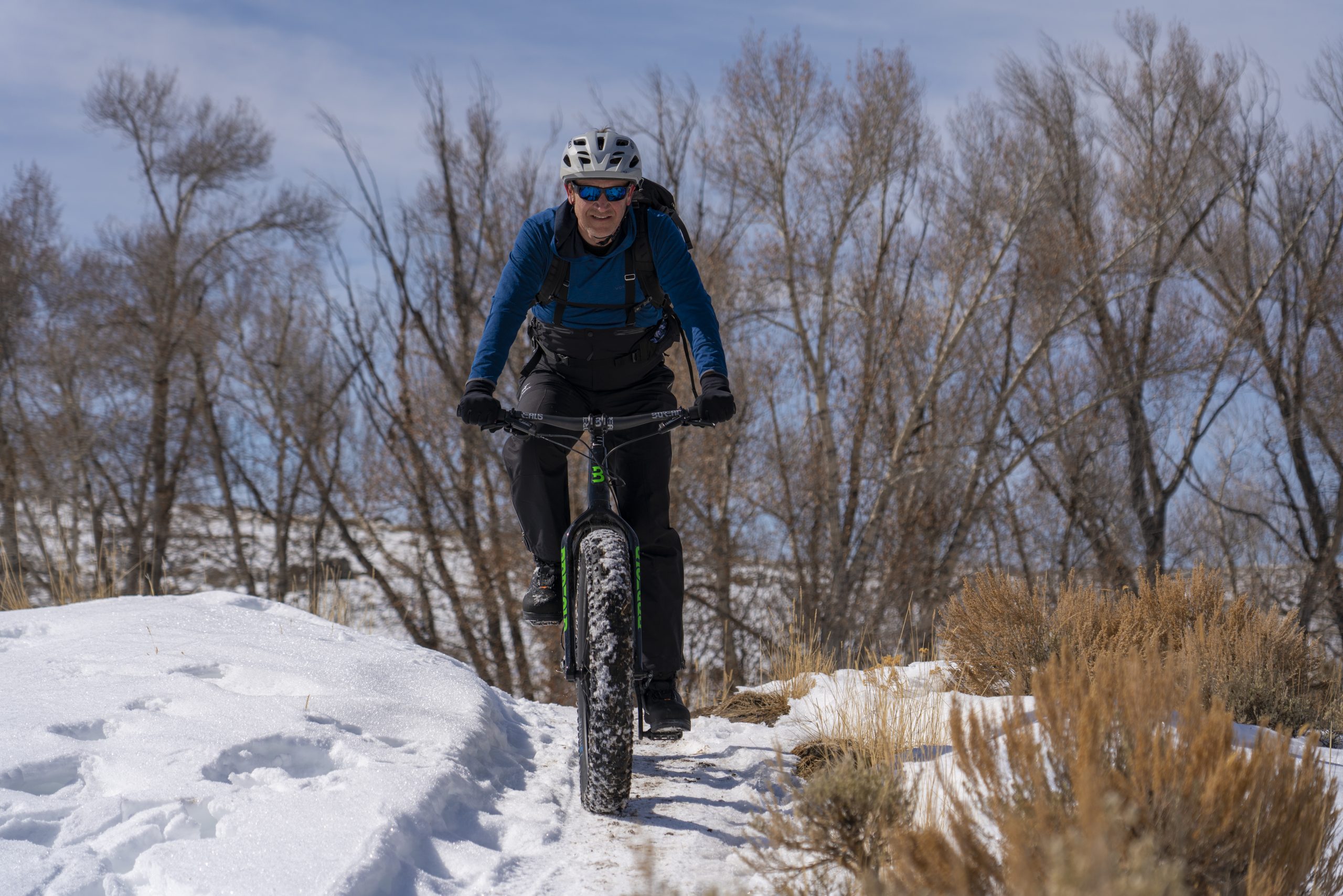 A man rides a fat bike on a colorado winter vacation