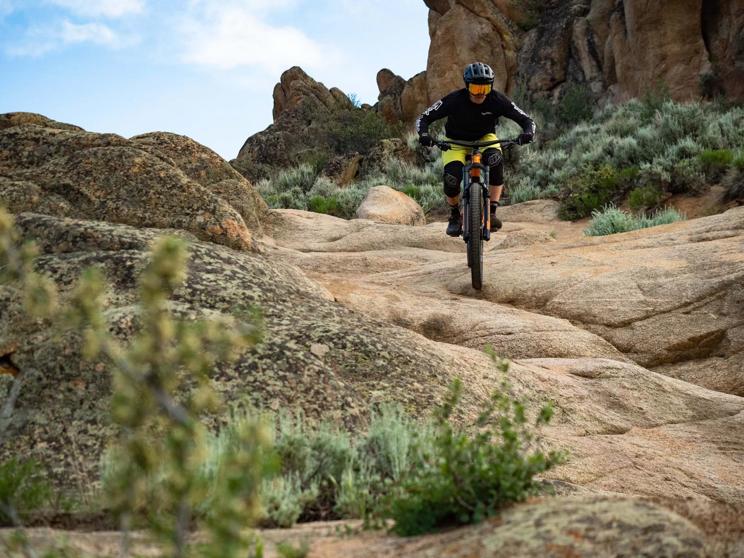 A man rides a mountain bike on a dirt trail