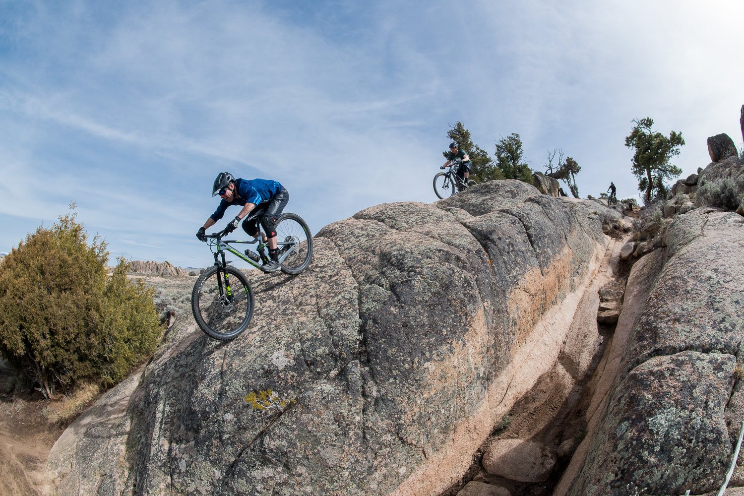 A person riding a bike down a rocky slope at Hartman Rocks Gunnison