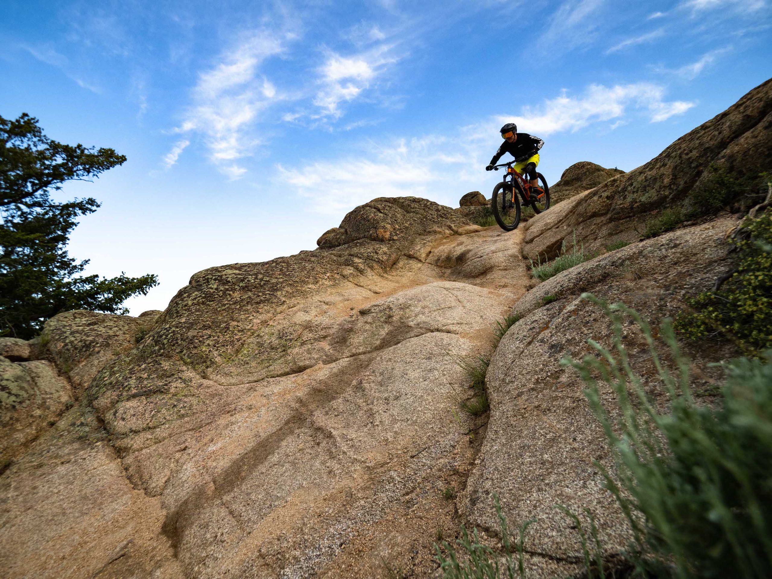 A man riding a bike down a rocky slope. Hartman Rocks MTB in Gunnison, CO