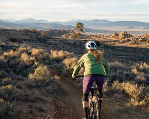 A woman mountain bikes at Hartman Rocks in Gunnison, Colorado.