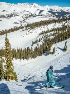 A skier looks down Hawk's Nest at Crested Butte.