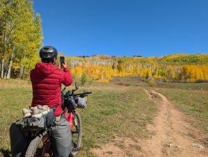 Kebler Pass gravel biking with changing aspen leaves in fall.