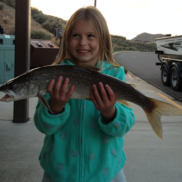 kid with a fish near Blue Mesa