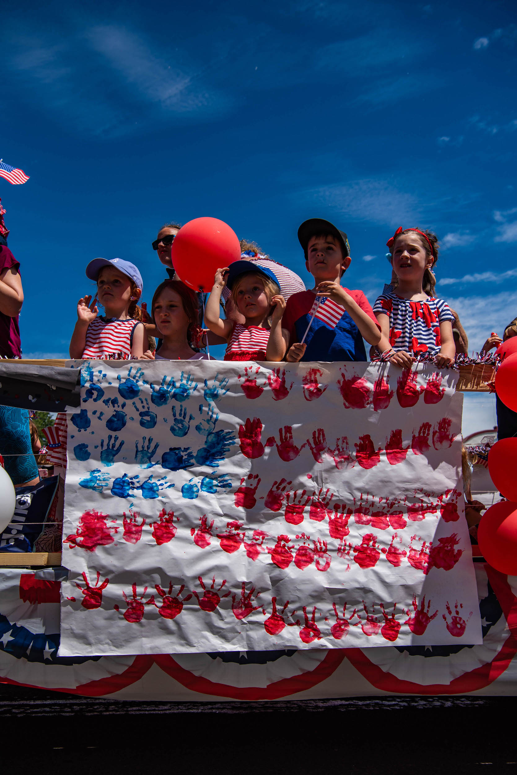 A group of kids on a Fourth of July float in Crested Butte. The parade is one of many fun family summer activities