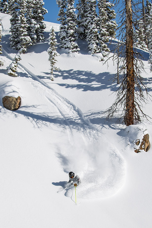 Spring skiing snow lone skier skiing Crested Butte Mountain Resort