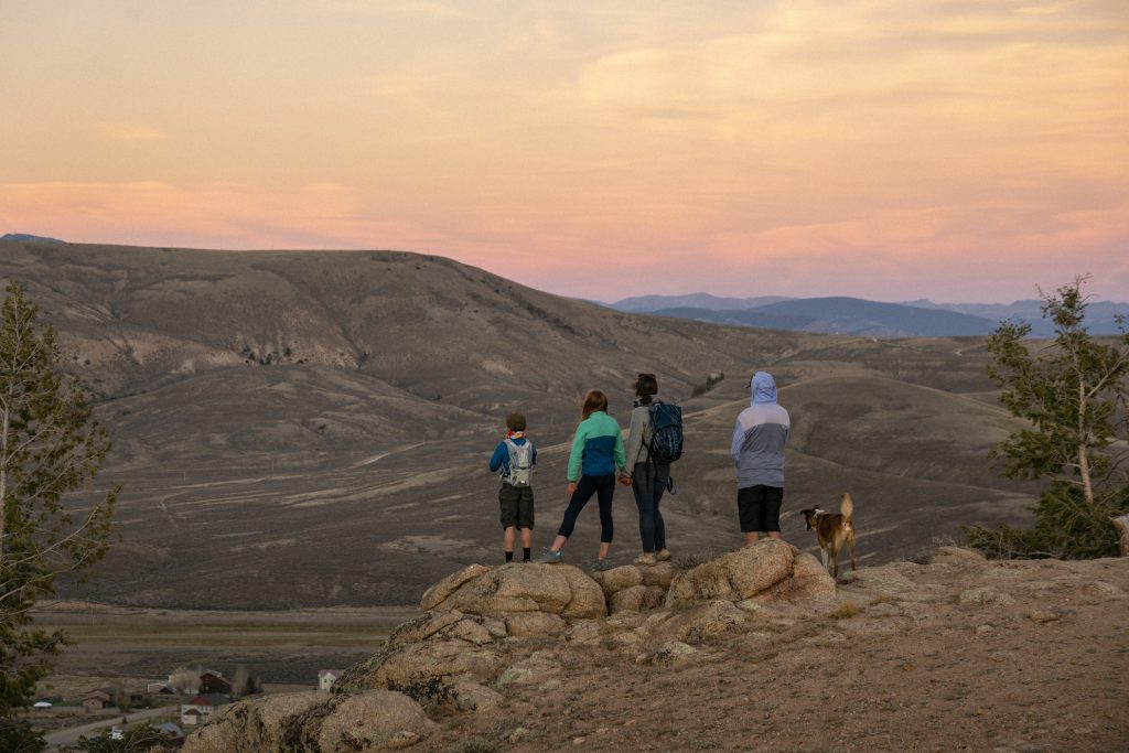 four people hiking at sunset in hartman rocks gunnison